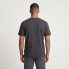 Back view of the FT070 Signature Side Print Relaxed Fit T-Shirt in dark grey, showing a subtle black graphic on the lower